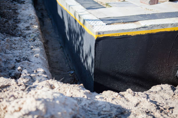 Professional Basement Waterproofing technician working in North Rose, NY